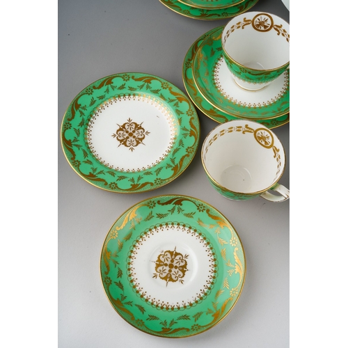 An early 20th century Minton tea set, green ground with gilt decoration ...