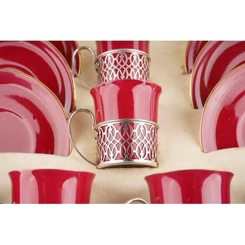 6 - A Cased Set of Six George V Silver-Mounted Coffee-Cups and Saucers, Pierced Silver Mounts ,The Porce... 