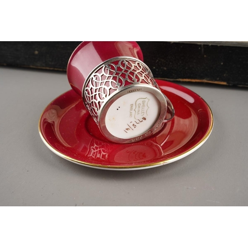 6 - A Cased Set of Six George V Silver-Mounted Coffee-Cups and Saucers, Pierced Silver Mounts ,The Porce... 