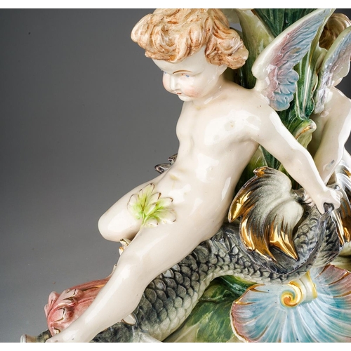 9 - An early 20th Century German Majolica style large table centrepiece, the detachable oval bowl with a... 