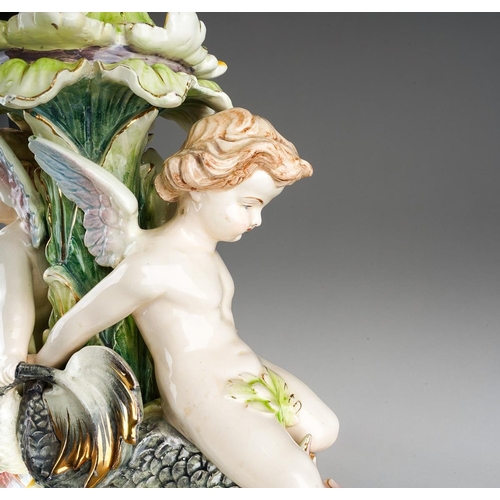 9 - An early 20th Century German Majolica style large table centrepiece, the detachable oval bowl with a... 