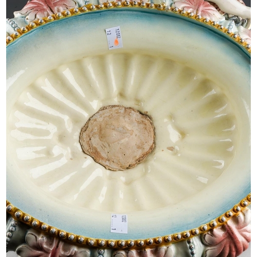9 - An early 20th Century German Majolica style large table centrepiece, the detachable oval bowl with a... 