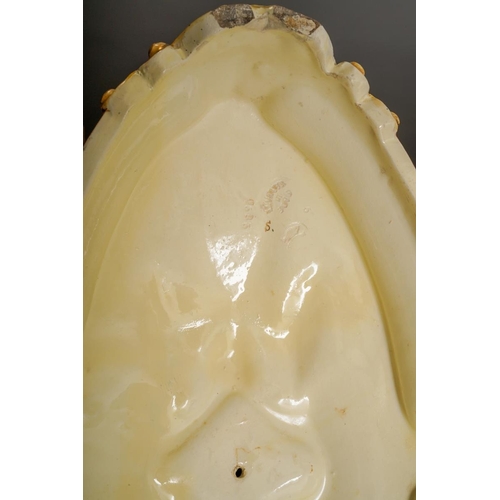 9 - An early 20th Century German Majolica style large table centrepiece, the detachable oval bowl with a... 