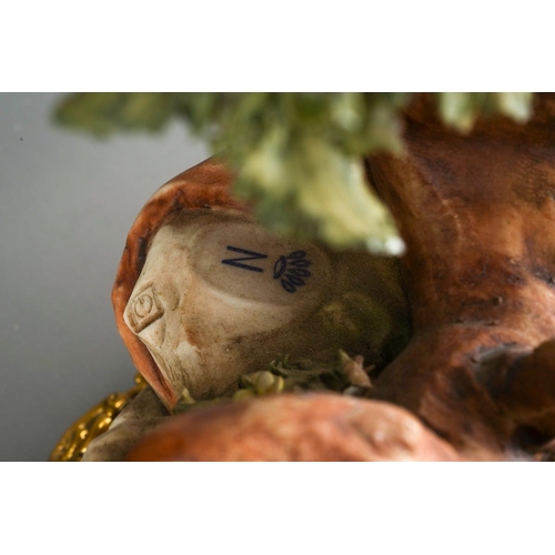 11 - A Continental porcelain Rococo style mantle clock., the apple green and gilt scrolling case applied ... 