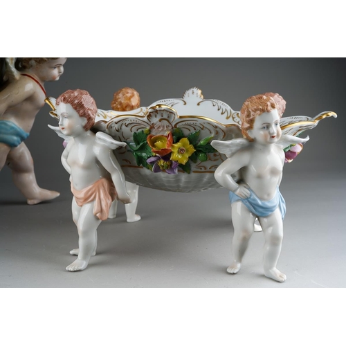 13 - A German porcelain large fruit bowl, the shaped bowl with diamond lozenge piercing applied with rose... 