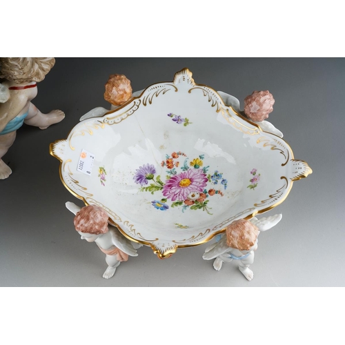 13 - A German porcelain large fruit bowl, the shaped bowl with diamond lozenge piercing applied with rose... 