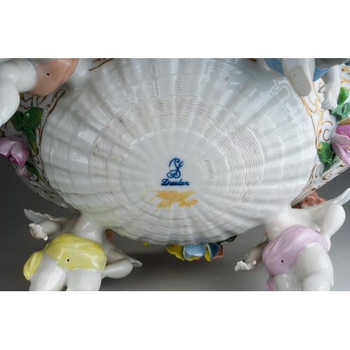 13 - A German porcelain large fruit bowl, the shaped bowl with diamond lozenge piercing applied with rose... 