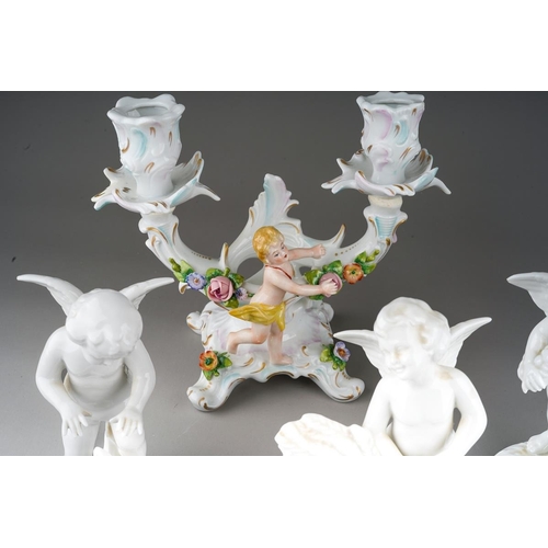 15 - A pair of Dresden Sitzendorf figural candelabra., the urn shaped sconces on scroll branches applied ... 