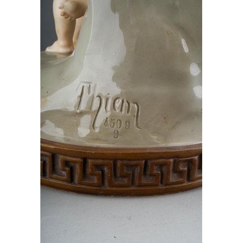 16 - An Austrian Ernst Wahliss Turn Wien centrepiece, circa 1900,modelled as The Disarming of Cupid., the... 