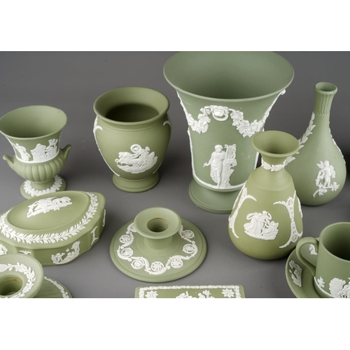 19 - A collection of green Wedgwood jasperware, including dwarf candlesticks, vases, pin dishes, coffee c... 