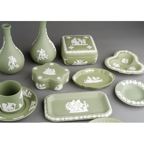 19 - A collection of green Wedgwood jasperware, including dwarf candlesticks, vases, pin dishes, coffee c... 