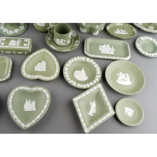 19 - A collection of green Wedgwood jasperware, including dwarf candlesticks, vases, pin dishes, coffee c... 