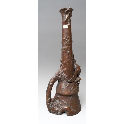 22 - A large Bretby brown painted vase modelled with a mermaid and iris flowers, carrying handle., stampe... 