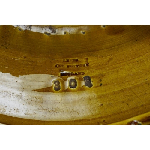 26 - A late Victorian Burmantofts green glaze jardiniere pedestal, relief moulded with sunflowers and geo... 