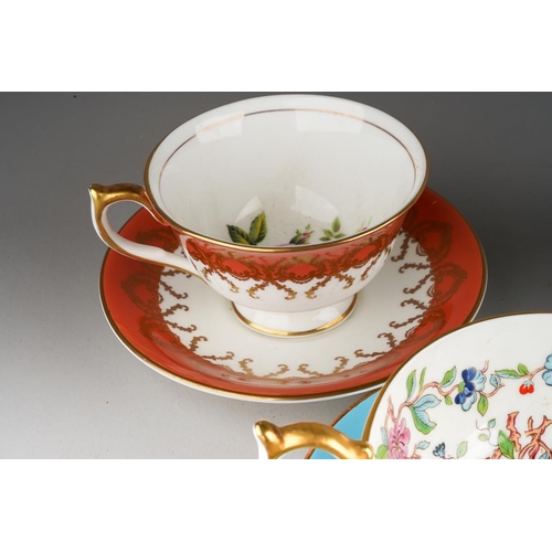 34 - A handpainted Brookdale coffee cup and saucer decorated with fruit and cobalt borders, signed J Mott... 