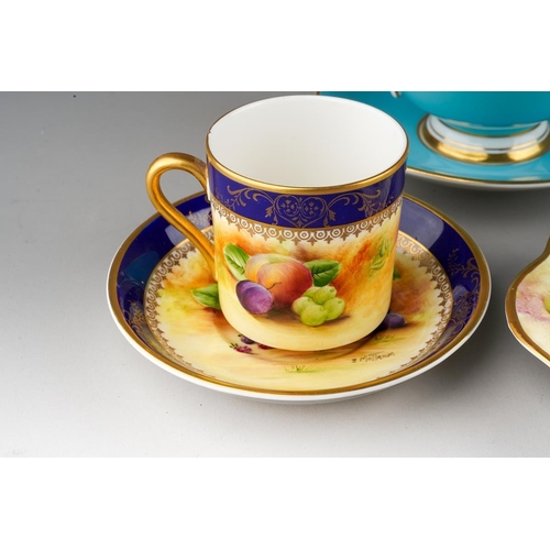 34 - A handpainted Brookdale coffee cup and saucer decorated with fruit and cobalt borders, signed J Mott... 