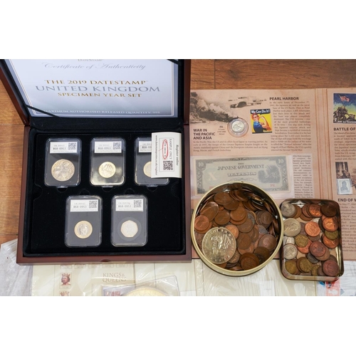1106 - A box of assorted commemorative and circulated  coins and stamps, in presentation packs and loose, i... 