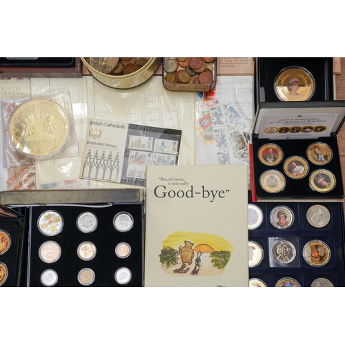 1106 - A box of assorted commemorative and circulated  coins and stamps, in presentation packs and loose, i... 
