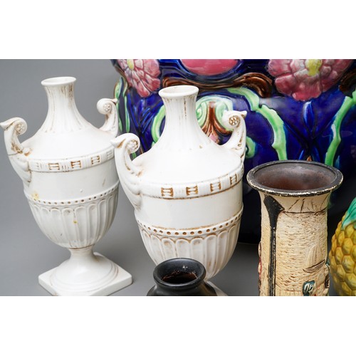 21 - A large Victorian blue glazed jardiniere, relief moulded with flowers (af), together with a pair of ... 