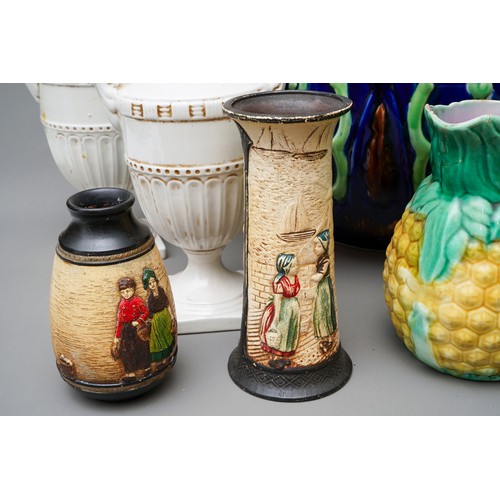 21 - A large Victorian blue glazed jardiniere, relief moulded with flowers (af), together with a pair of ... 