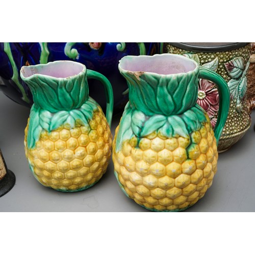 21 - A large Victorian blue glazed jardiniere, relief moulded with flowers (af), together with a pair of ... 