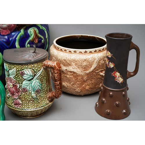 21 - A large Victorian blue glazed jardiniere, relief moulded with flowers (af), together with a pair of ... 