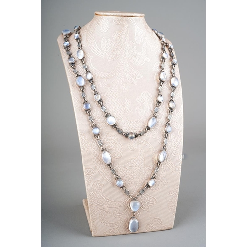 92 - A silver and moonstone necklace, set with fifty one oval moonstones, flowerhead shaped links, no cla... 