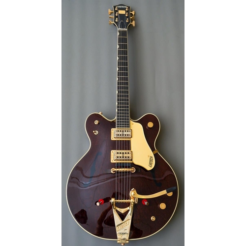 A modern Gretsch "Chet Atkins Country Gentleman" with Bigsby six string walnut stain guitar, marked to the back JT17072048 MADE IN JAPAN, purchased in 2018, comes with receipt of purchase, warranty, etc, in a Gretsch hard carry case
