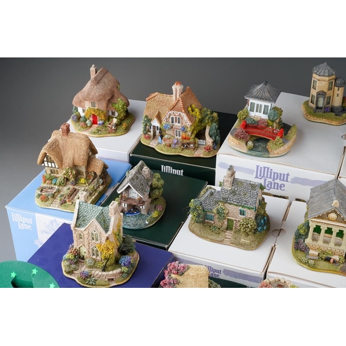 617 - Twenty six small Lilliput Lane models, the majority boxed, comprising two Christmas baubles The Donk... 