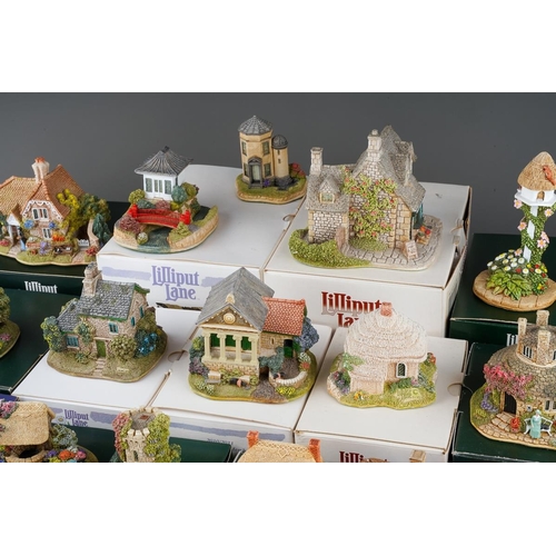617 - Twenty six small Lilliput Lane models, the majority boxed, comprising two Christmas baubles The Donk... 