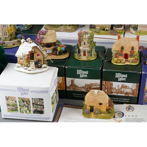 617 - Twenty six small Lilliput Lane models, the majority boxed, comprising two Christmas baubles The Donk... 