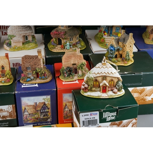 617 - Twenty six small Lilliput Lane models, the majority boxed, comprising two Christmas baubles The Donk... 