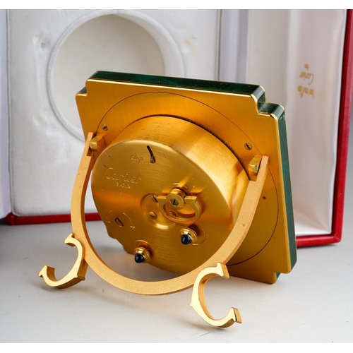 770 - Cartier Paris: a late 20th Century brass and green enamel travel alarm clock, the white enamel dial ... 