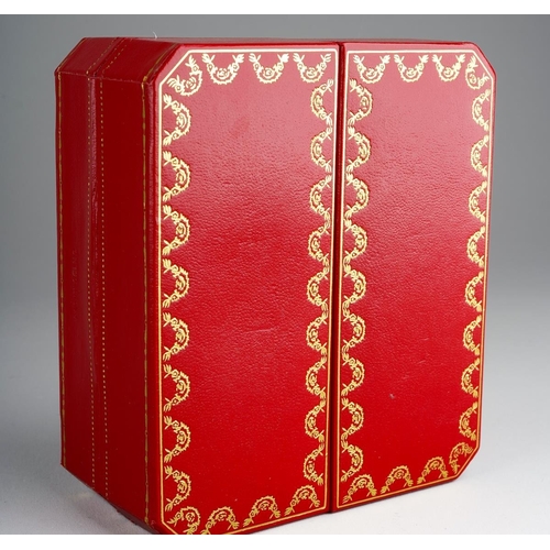 770 - Cartier Paris: a late 20th Century brass and green enamel travel alarm clock, the white enamel dial ... 