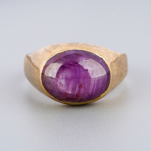1 - Yellow metal ( marked 9k) ring set with a purple stone, UK size Q 1/2, gross weight approx. 5.9g
