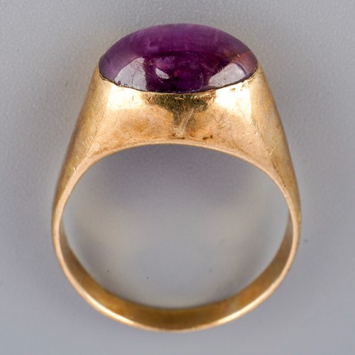 1 - Yellow metal ( marked 9k) ring set with a purple stone, UK size Q 1/2, gross weight approx. 5.9g