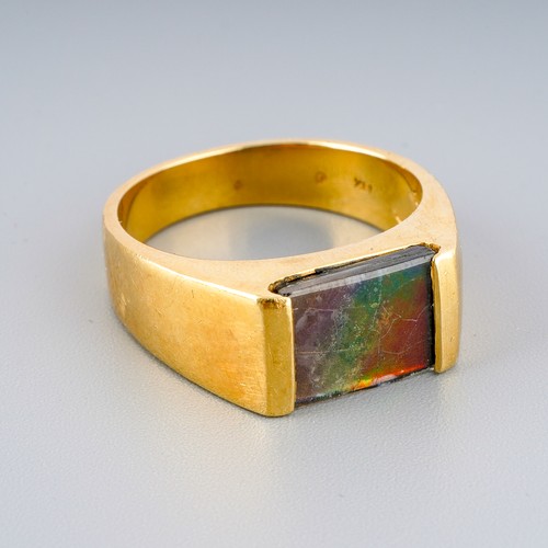 2 - Yellow metal ( marked 18k) ring set with ammolite, UK size S, gross weight approx. 8.8g