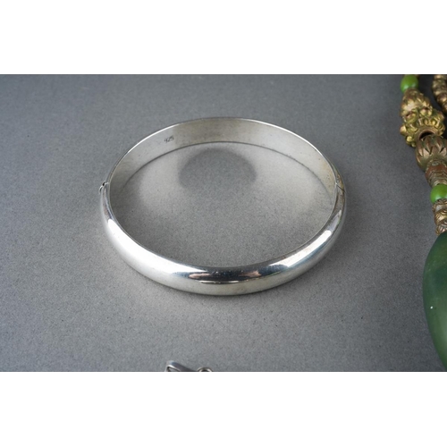 27 - Silver pendant locket, white metal ( marked 925) bangle and  a Tibetan style necklace, weighable sil... 