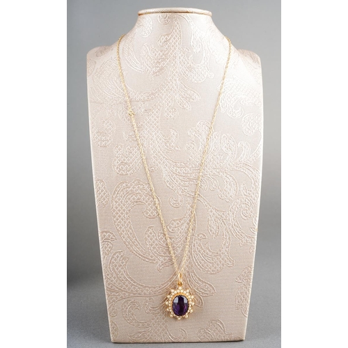 28 - An amethyst and seed pearl pendant with chain. Approx length pendant 26mm, approx length chain 450mm... 