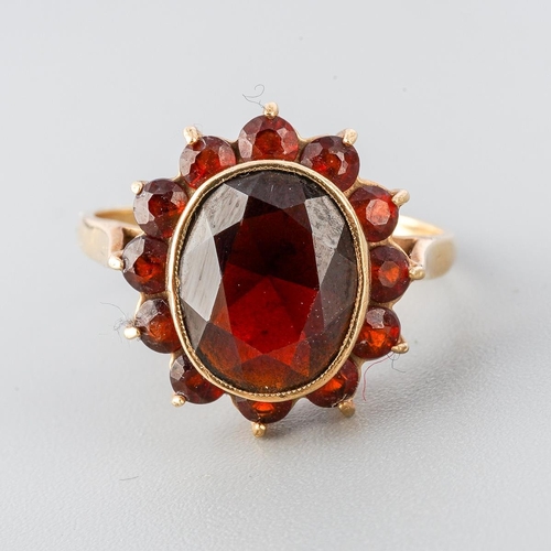 30 - A 9ct gold garnet cluster ring. Hallmarked 9ct gold, approx ring size M, approx gross weight 2.8 gra... 