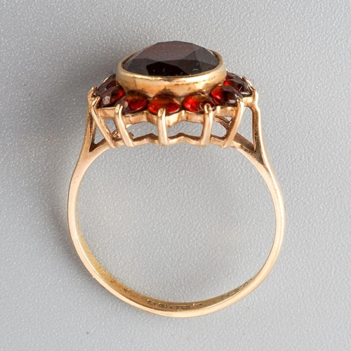 30 - A 9ct gold garnet cluster ring. Hallmarked 9ct gold, approx ring size M, approx gross weight 2.8 gra... 