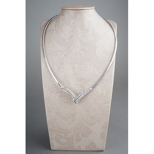 37 - A 9ct white gold diamond set necklace. The chevron-shape front set throughout with graduating round ... 