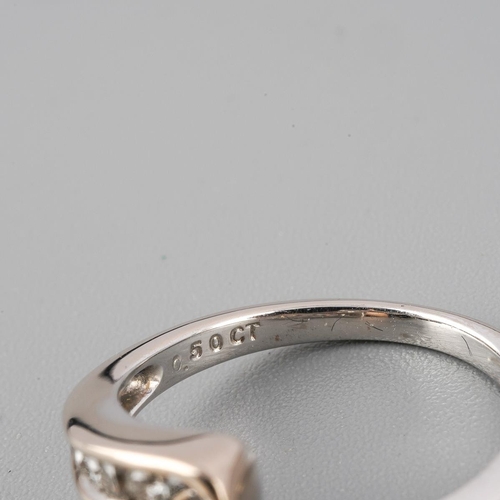 38 - An 18ct white gold diamond cross over ring. Set with round brilliant cut diamonds. Approx ring size ... 