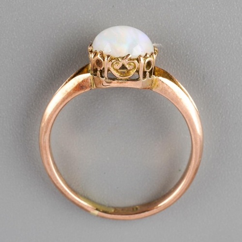 40 - A mid 20th century opal single stone ring. Set with a cushion-shape opal cabochon, to the split shou... 