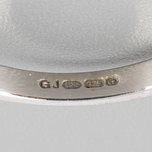 42 - A 9ct gold sapphire and diamond three stone ring. Set with an oval shape sapphire, flanked to each s... 