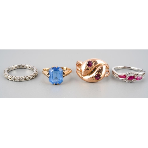43 - A collection of four cubic zirconia and gem-set rings. To include a cubic zirconia eternity ring (un... 
