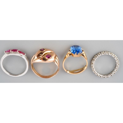 43 - A collection of four cubic zirconia and gem-set rings. To include a cubic zirconia eternity ring (un... 