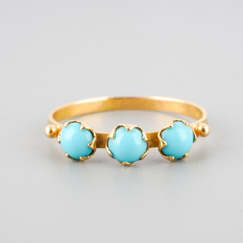 45 - An 18k gold three stone ring set with turquoise, UK size L, gross weight approx. 1.2g