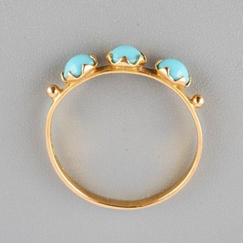 45 - An 18k gold three stone ring set with turquoise, UK size L, gross weight approx. 1.2g