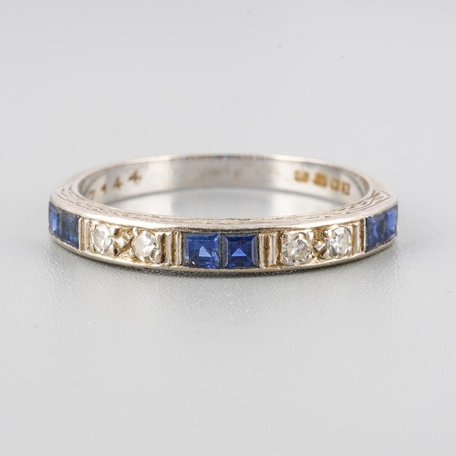49 - An 18ct white gold diamond and sapphire eternity ring. Set with single-cut diamonds, grain set and c... 